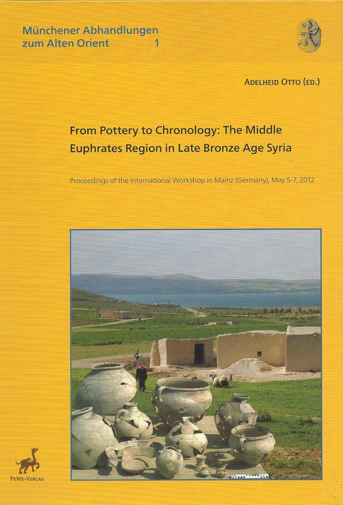 yellow book cover with ceramic vessels in the foreground and landscape view in the background